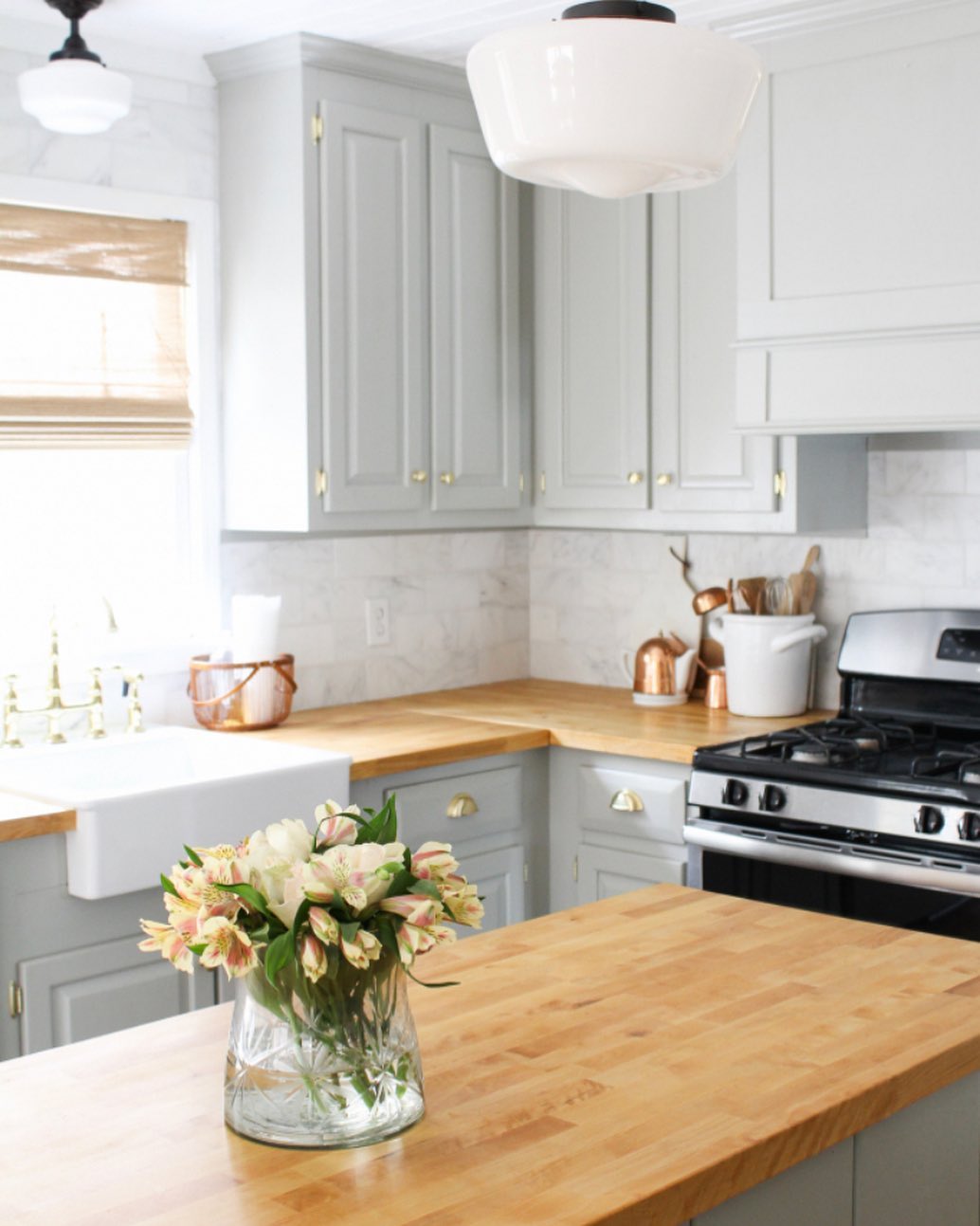 Soft grey kitchen with warm butcher block countertops