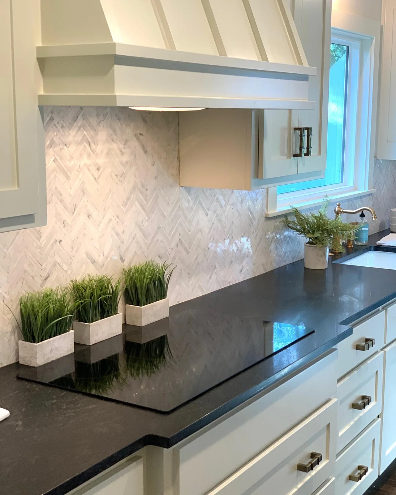 Black Mist honed natural stone countertop in a bright kitchen
